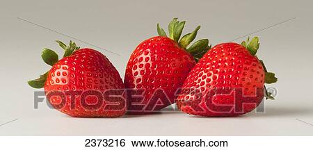 Agriculture - Three strawberries on a white surface. View Large Photo Image Stock Photograph - Agriculture - Three strawberries on a white surface.. Fotosearch