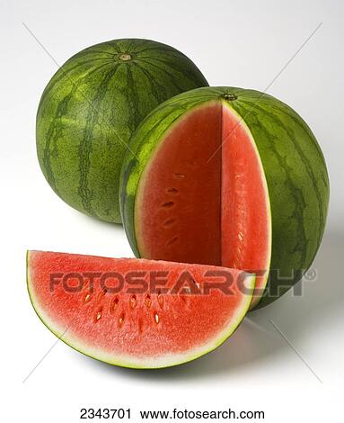 Agriculture - Watermelons, one with a sliced wedge, on a white surface. View Large Photo Image Stock Image - Agriculture - Watermelons, one with a sliced wedge, on a white surface.. Fotosearch