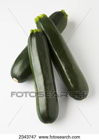 Agriculture - Zucchinis on a white surface. View Large Photo Image Stock Photo - Agriculture - Zucchinis on a white surface.. Fotosearch