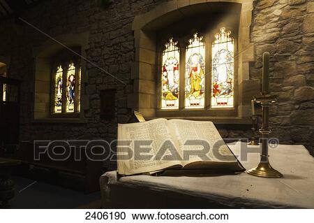 An open Bible on display in a church with colourful stained glass windows; Bamburgh, Northumberland, England View Large Photo Image Stock Image - An open Bible on display in a church with colourful stained glass windows; Bamburgh, Northumberland, England. Fotosearch