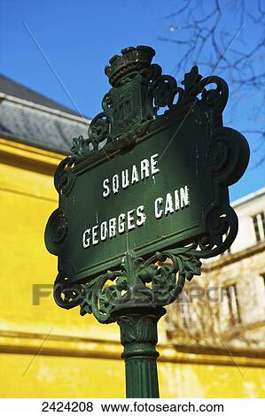 Stock Photo - An ornate sign in the historical district of Marais; Paris, France. Fotosearch