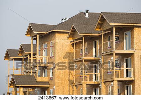 Apartment building under construction; St. Albert, Alberta, Canada View Large Photo Image Stock Photo - Apartment building under construction; St. Albert, Alberta, Canada. Fotosearch