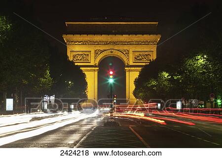Stock Photo - Arc de Triomphe at nighttime; Paris, France. Fotosearch