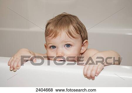 Baby girl in the bathtub; Spruce Grove, Alberta, Canada View Large Photo Image Stock Photo - Baby girl in the bathtub; Spruce Grove, Alberta, Canada. Fotosearch