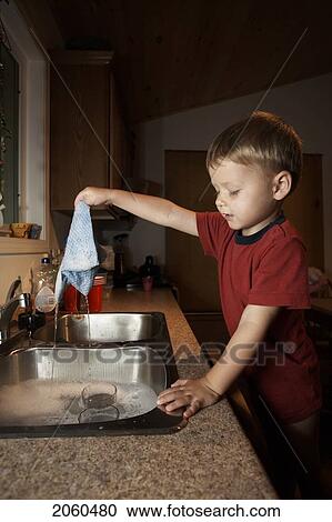 Boy Washing Dishes View Large Photo Image Stock Image - Boy Washing Dishes. Fotosearch