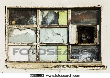 Stock Image - Broken window; Bridgetown, Barbados. Fotosearch