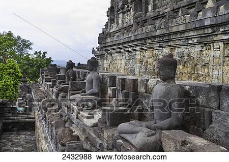 Buddha statues on a gallery of Candi Borubudur, Borobudur Temple Compounds, Central Java, Indonesia View Large Photo Image Stock Photo - Buddha statues on a gallery of Candi Borubudur, Borobudur Temple Compounds, Central Java, Indonesia. Fotosearch