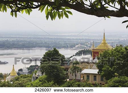 Buddhist temples and the Ayeyarwady River; Sagaing, Sagaing Region, Burma View Large Photo Image Stock Photo - Buddhist temples and the Ayeyarwady River; Sagaing, Sagaing Region, Burma. Fotosearch