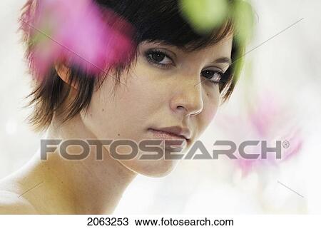 Cactus Flower Blurred In Foreground Of Portrait Of Young Woman, Canada, Manitoba, Brandon View Large Photo Image Stock Image - Cactus Flower Blurred In Foreground Of Portrait Of Young Woman, Canada, Manitoba, Brandon. Fotosearch