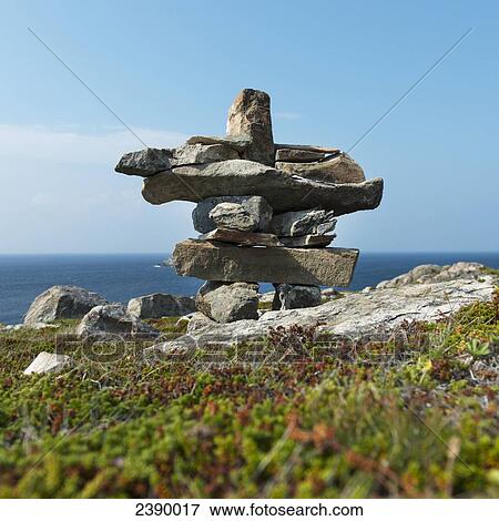 Cairn on the shore of the atlantic coast; Newfoundland and Labrador, Canada View Large Photo Image Stock Photo - Cairn on the shore of the atlantic coast; Newfoundland and Labrador, Canada. Fotosearch