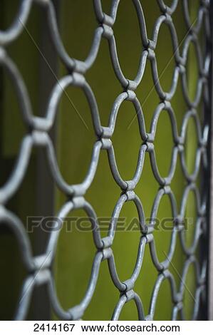 Chain link fence and a green wall; Barcelona, Spain View Large Photo Image Stock Photo - Chain link fence and a green wall; Barcelona, Spain. Fotosearch