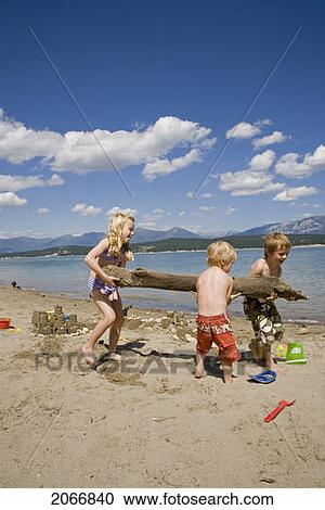Children Playing On Beach On Lake Koocanusa In The East Kootenays Near Fernie, British Columbia, Canada View Large Photo Image Stock Image - Children Playing On Beach On Lake Koocanusa In The East Kootenays Near Fernie, British Columbia, Canada. Fotosearch