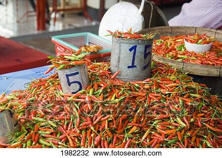 Chilli peppers for sale at a market; Mae Hong Son Province, Thailand View Large Photo Image Stock Image - Chilli peppers for sale at a market; Mae Hong Son Province, Thailand. Fotosearch