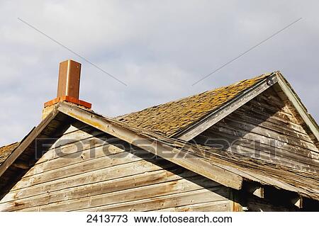 Stock Image - Chimney of an abandoned farm house in a rural setting; St. Albert, Alberta, Canada. Fotosearch
