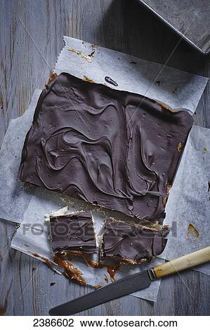 Stock Image - Chocolate shortbread millionaire bars. Fotosearch