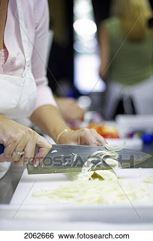 Chopping A Celery Stalk With Large Knife In The Kitchen View Large Photo Image Stock Photograph - Chopping A Celery Stalk With Large Knife In The Kitchen. Fotosearch