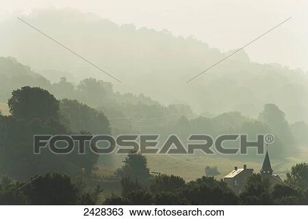 Church and house of Le Vey on misty morning, near Clecy; Swiss Normandy, Normandy, France View Large Photo Image Stock Image - Church and house of Le Vey on misty morning, near Clecy; Swiss Normandy, Normandy, France. Fotosearch