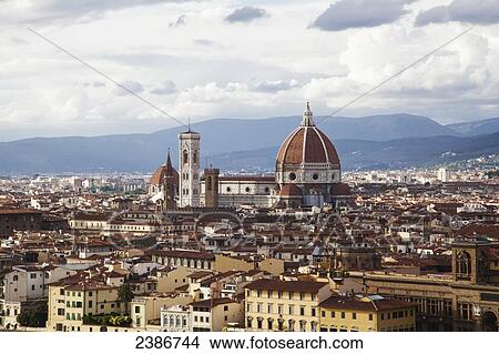 Picture - Cityscape of Florence and Basilica of Saint Mary of the Flower under a cloudy sky; Florence, Tuscany, Italy. Fotosearch