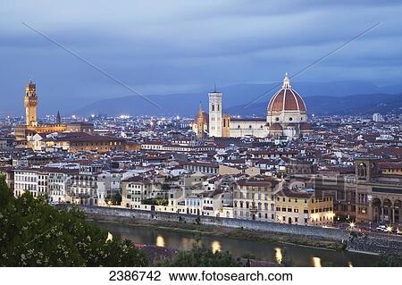 Stock Image - Cityscape of Florence and Basilica of Saint Mary of the Flower under a cloudy sky; Florence, Tuscany, Italy. Fotosearch
