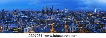 Stock Image - Cityscape of London with various buildings in the skyline at dusk; London, England. Fotosearch