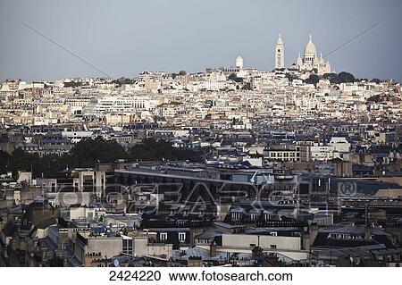 Cityscape of Paris and buildings against a blue sky; Paris, France View Large Photo Image Stock Image - Cityscape of Paris and buildings against a blue sky; Paris, France. Fotosearch