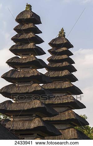 Classical tiered thatched-roofs merus (towers) in the Royal Water Temple Pura Taman Ayun, Mengwi, Bali, Indonesia View Large Photo Image Stock Image - Classical tiered thatched-roofs merus (towers) in the Royal Water Temple Pura Taman Ayun, Mengwi, Bali, Indonesia. Fotosearch