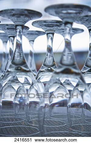Clean glass stemware placed upside down on a shelf; France View Large Photo Image Stock Image - Clean glass stemware placed upside down on a shelf; France. Fotosearch
