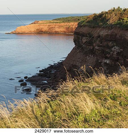 Cliffs along the coastline and the horizon of the atlantic ocean; Green Gables, Prince Edward Island, Canada View Large Photo Image Stock Photo - Cliffs along the coastline and the horizon of the atlantic ocean; Green Gables, Prince Edward Island, Canada. Fotosearch
