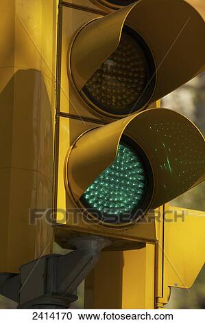 Stock Image - Close up of a green traffic light; Barcelona, Spain. Fotosearch