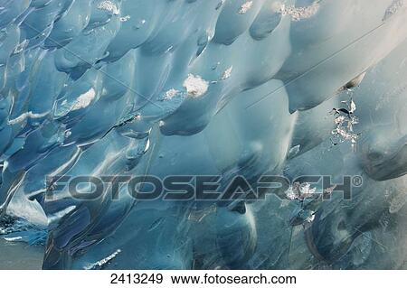Close up of iceberg broken off Mendenhall Glacier floating in Mendenhall lake, flipping over and exposing blue polished ice from being underwater; Juneau, Alaska, United States of America View Large Photo Image Stock Photo - Close up of iceberg broken off Mendenhall Glacier floating in Mendenhall lake, flipping over and exposing blue polished ice from being underwater; Juneau, Alaska, United States of America. Fotosearch
