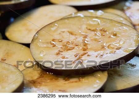 Close up of sliced eggplant and water droplets; Calgary, Alberta, Canada View Large Photo Image Stock Photography - Close up of sliced eggplant and water droplets; Calgary, Alberta, Canada. Fotosearch