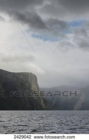 Clouds and rainfall over the cliffs in Norris Point, Gros Morne National Park; Newfoundland, Canada View Large Photo Image Stock Image - Clouds and rainfall over the cliffs in Norris Point, Gros Morne National Park; Newfoundland, Canada. Fotosearch