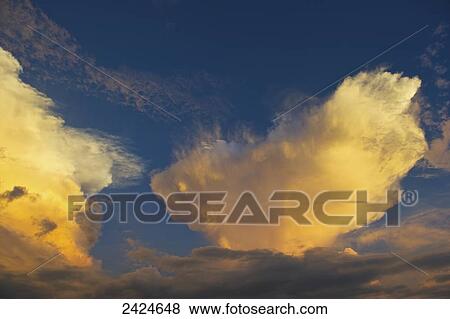 Clouds glowing in a blue sky; Ulpotha, Embogama, Sri Lanka View Large Photo Image Stock Photo - Clouds glowing in a blue sky; Ulpotha, Embogama, Sri Lanka. Fotosearch