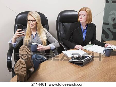 Co-worker texting with surprised boss watching; Edmonton, Alberta, Canada View Large Photo Image Stock Image - Co-worker texting with surprised boss watching; Edmonton, Alberta, Canada. Fotosearch