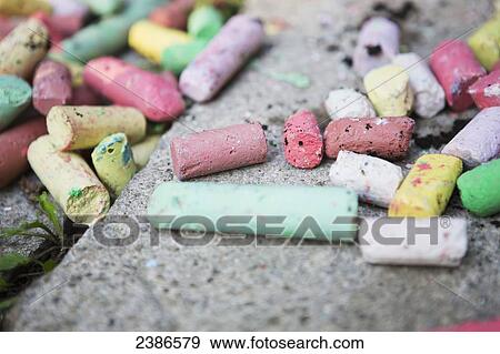 Stock Photo - Colourful sidewalk chalk on the pavement; Toronto, Ontario, Canada. Fotosearch