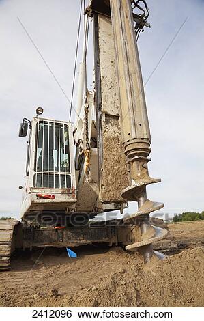 Construct project drilling pilings for warehouse development; Edmonton, Alberta, Canada View Large Photo Image Stock Photograph - Construct project drilling pilings for warehouse development; Edmonton, Alberta, Canada. Fotosearch