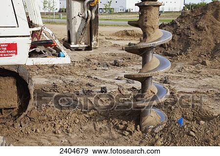 Construction project drilling pilings for warehouse development; Edmonton, Alberta, Canada View Large Photo Image Stock Photo - Construction project drilling pilings for warehouse development; Edmonton, Alberta, Canada. Fotosearch