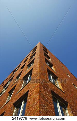 Corner of a brick building and blue sky; Hamburg, Germany View Large Photo Image Stock Photo - Corner of a brick building and blue sky; Hamburg, Germany. Fotosearch