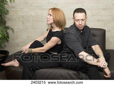 Couple back to back pretending to fight; Edmonton, Alberta, Canada View Large Photo Image Stock Photography - Couple back to back pretending to fight; Edmonton, Alberta, Canada. Fotosearch