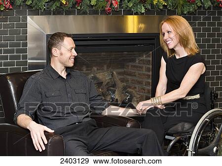 Couple spending quality time together at Christmas, wife with a disability; Edmonton, Alberta, Canada View Large Photo Image Stock Photo - Couple spending quality time together at Christmas, wife with a disability; Edmonton, Alberta, Canada. Fotosearch