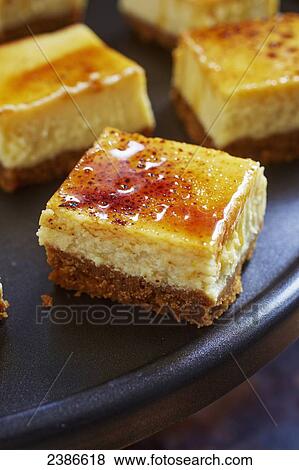 Creme brulee cheesecake squares View Large Photo Image Stock Photo - Creme brulee cheesecake squares. Fotosearch