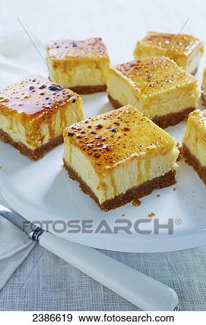 Stock Photo - Creme brulee cheesecake squares. Fotosearch