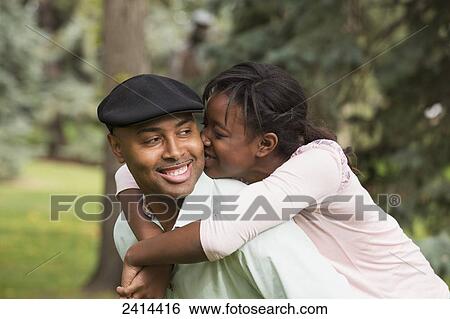 Daughter hugging her father in a park; Edmonton, Alberta, Canada View Large Photo Image Stock Photograph - Daughter hugging her father in a park; Edmonton, Alberta, Canada. Fotosearch