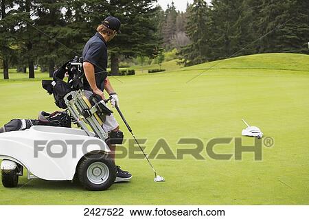 Disabled golfer in a tournament using high tech mobility aid; Edmonton, Alberta, Canada View Large Photo Image Stock Image - Disabled golfer in a tournament using high tech mobility aid; Edmonton, Alberta, Canada. Fotosearch