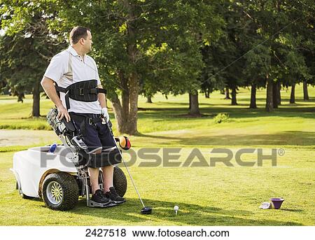 Disabled golfer in a tournament using high tech mobility aid; Edmonton, Alberta, Canada View Large Photo Image Stock Photo - Disabled golfer in a tournament using high tech mobility aid; Edmonton, Alberta, Canada. Fotosearch