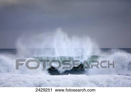 Stock Image - Dramatic ocean wave off the coast of Southern Iceland near the Blue Lagoon; Grindavik, Iceland. Fotosearch