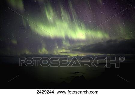 Dramatic scene of the northern lights showing the Atlantic Ocean off the coast of Iceland; Iceland View Large Photo Image Picture - Dramatic scene of the northern lights showing the Atlantic Ocean off the coast of Iceland; Iceland. Fotosearch