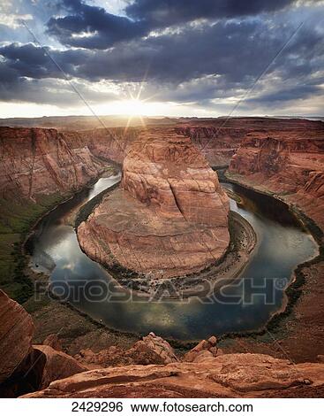 Stock Photograph - Dramatic sunset at Horseshoe Bend; Page, Arizona, United States of America. Fotosearch