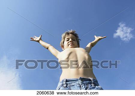 Eight Year Old Boy With Arms Outstretched, Winnipeg, Canada View Large Photo Image Stock Photo - Eight Year Old Boy With Arms Outstretched, Winnipeg, Canada. Fotosearch