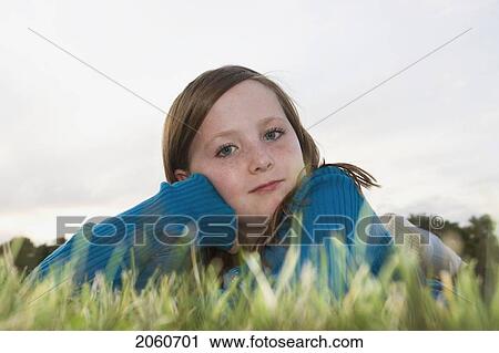 Eight Year Old Girl At Twilight Lying In Grass, Winnipeg, Canada View Large Photo Image Stock Image - Eight Year Old Girl At Twilight Lying In Grass, Winnipeg, Canada. Fotosearch